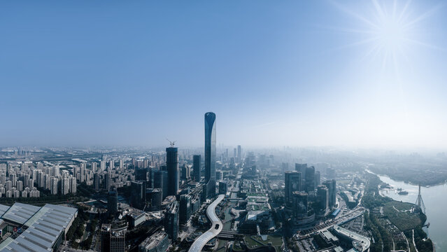 Aerial View of Modern Urban Skyline Under Clear Blue Sky