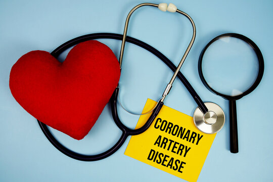 Coronary Artery Disease (CAD) text with stethoscope and red heart on blue background