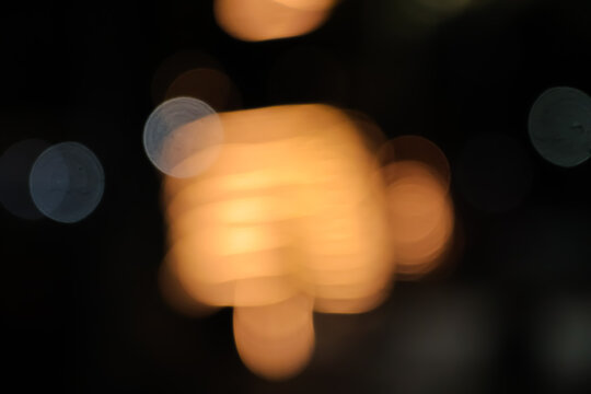 Abstract Golden Bokeh Lights with Hand Gesture Shape