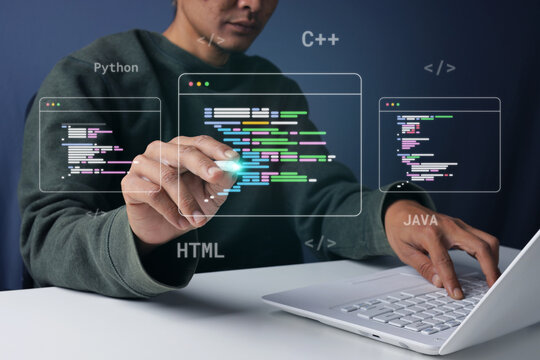 Man Coding on Laptop while Touching Floating Code Windows with Stylus Pen