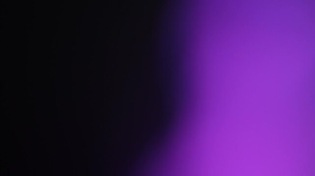 Soft Purple Light Leak Over Black Background