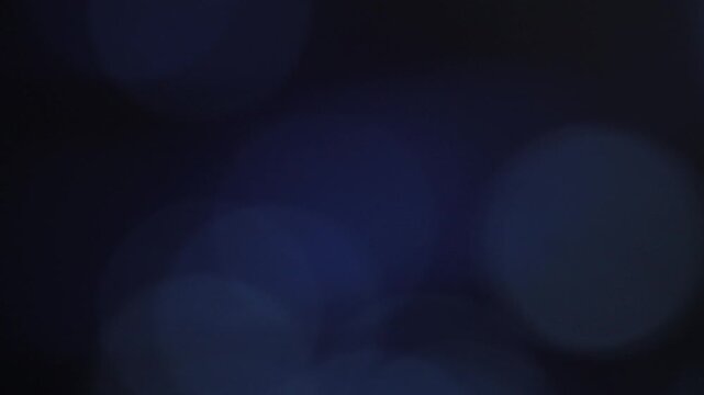 Abstract Blue Bokeh Background with Soft Light Leaks