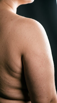 Close Up of Woman Bare Shoulder and Arm Showing Natural Skin Texture and Pores