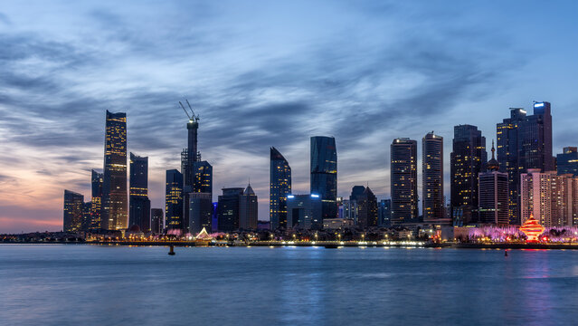 Qingdao Waterfront Skyline at Dusk with Modern Skyscrapers