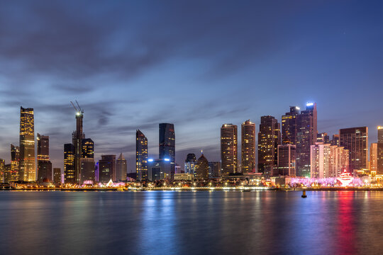 Twilight City Skyline Reflected on Calm Water