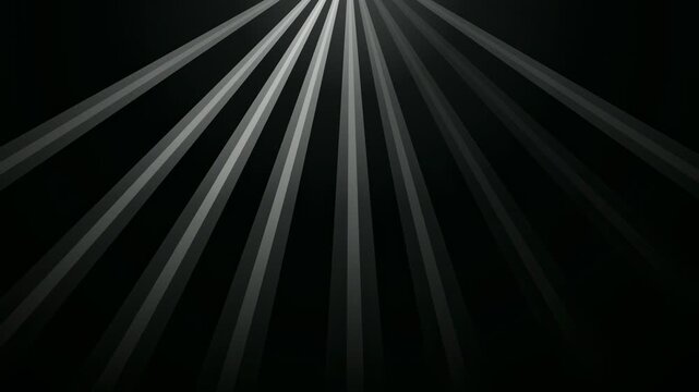 Abstract white light rays emanating from the center on a black background loop