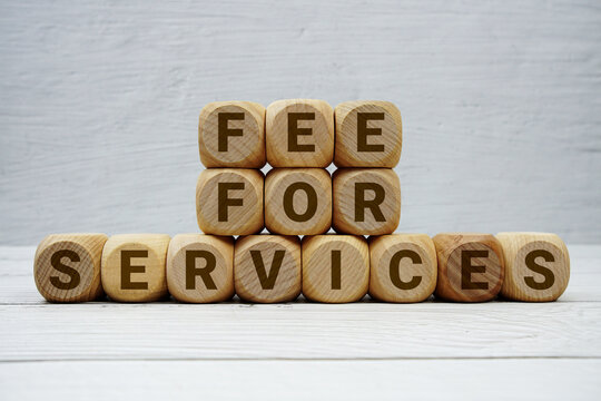 Fee For Services alphabet letters on wooden background
