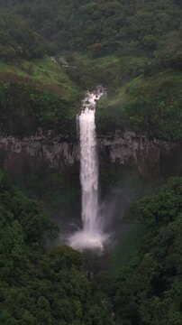 Vertical Aerial View of Barki Waterfall Amid Lush Green Forest Kolhapur Maharashtra