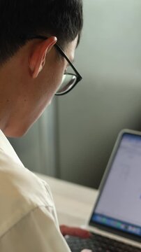 slow motion salesman employee work on laptop to do report about company profit monthly in office and check about financial or accounting for business strategy concept