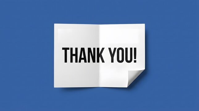 A folded white paper card with the text thank you written in bold black letters, centered against a solid blue background