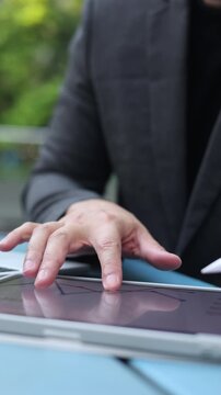 slow motion businessman hand point on dashboard statistic chart on digital tablet screen in office room to planning or analyzing the company's profit or business strategy for future technology