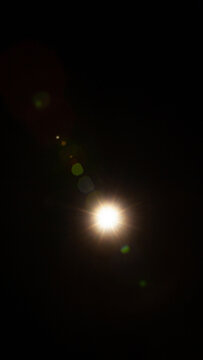 Sun flare on the black background
