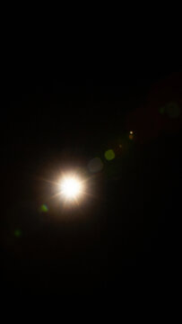 Sun flare on the black background