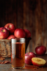 Apple juice with apples on an old kitchen table. © Igor Normann