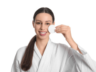 Skincare routine and facial cleansing, young woman using cotton pad for makeup removal in white bathrobe for daily beauty and wellness self care © Pixel-Shot