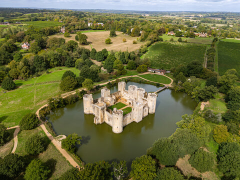 Wide aerial view of the medieval moated Bodiam Castle set in the Sussex countryside near Robertsbridge, East Sussex, England