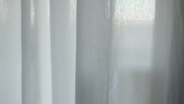 white cotton curtains with natural light on a cloudy day