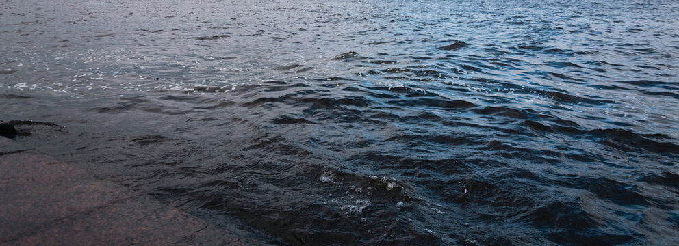 Close Up Of Dark Blue Sea Water Surface With Small Waves