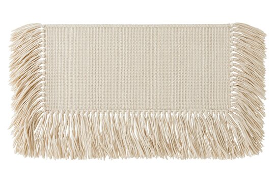Cream colored rectangular textile mat with long fringe tassels isolated on white background