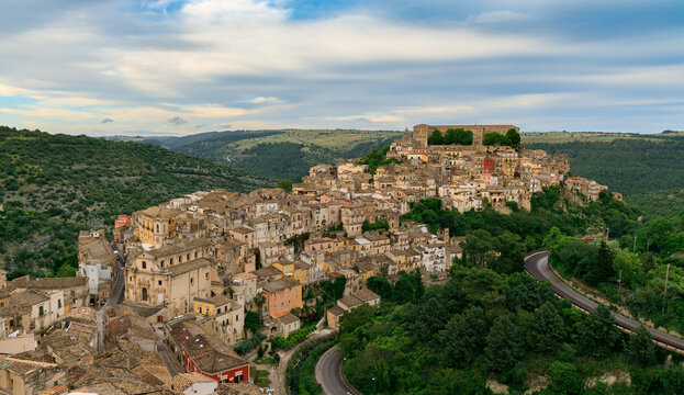 aerial view travel destination point panorama landmark city scape of Ragusa Italy ancient traditional architecture stone living houses and castle on a top of a hill