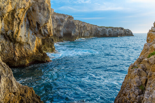 Rugged limestone frame rock natural scenic view of sea bay and cliffs shore line