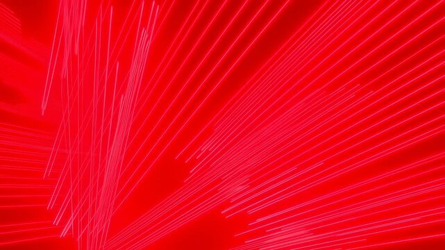 Red glowing linear beams expand and radiate outward across a digital abstract space background. Layered red tones enhance movement and depth.