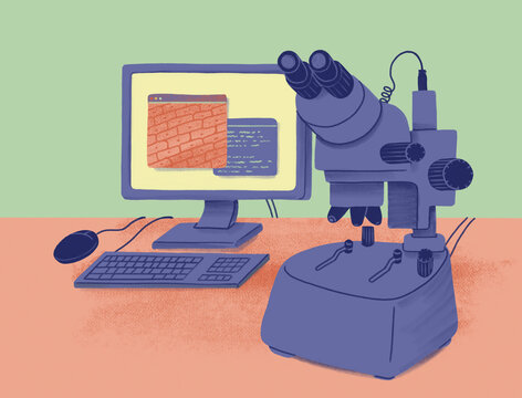 Microscope next to computer with scientific information on open windows