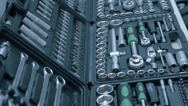 Samples of new sets of car wrench in toolboxes are presented at the exhibition. Closeup. Shot in motion. Follow focus