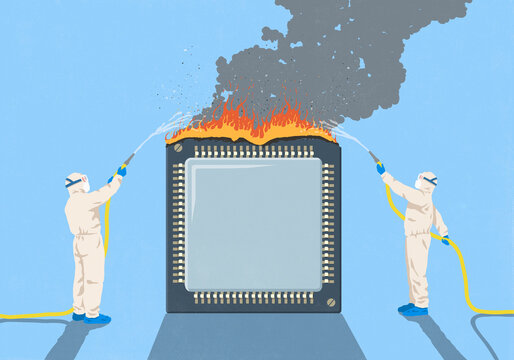 Workers in clean suits with hoses putting out fire on large semiconductor