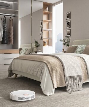 White modern vacuum cleaner robot working, vacuuming, cleaning beige carpet floor in luxury woman&rsquo;s bedroom with bed and wardrobe. Housework, smart home lifestyle, technology background 3D
