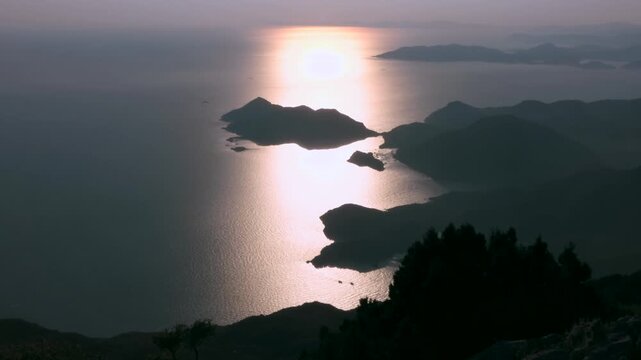 Sunset light reflects across Aegean islands near Fethiye, Turkey.