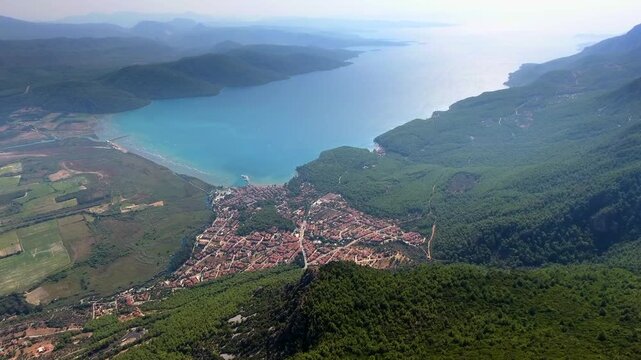 Aerial drone panorama of Akyaka Gokova in Mugla Turkey with delta plain, farms, forest, and sea.