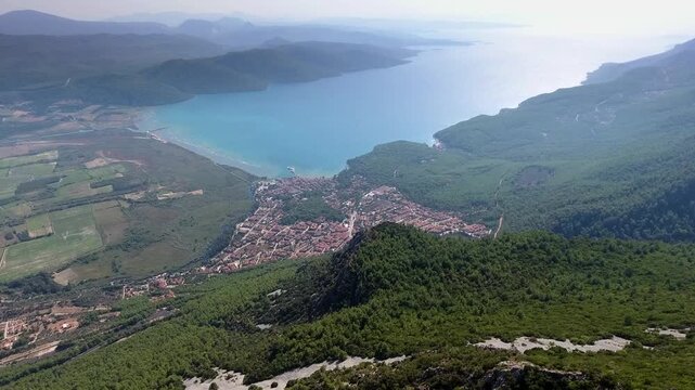 Aerial drone panorama of Akyaka Gokova in Mugla Turkey with delta plain, farms, forest, and sea.