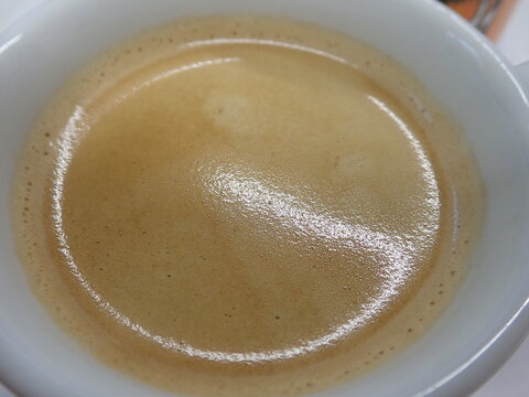 cup of fhresh caffee with cream