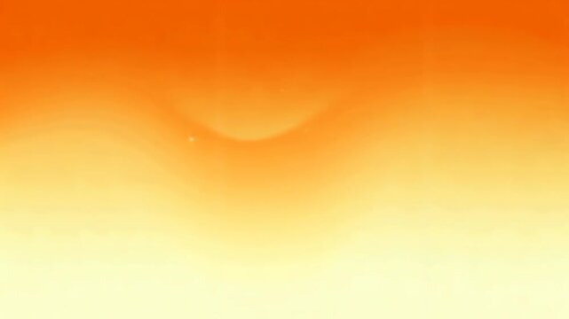 Abstract orange-yellow gradient background with subtle wave patterns and floating particles