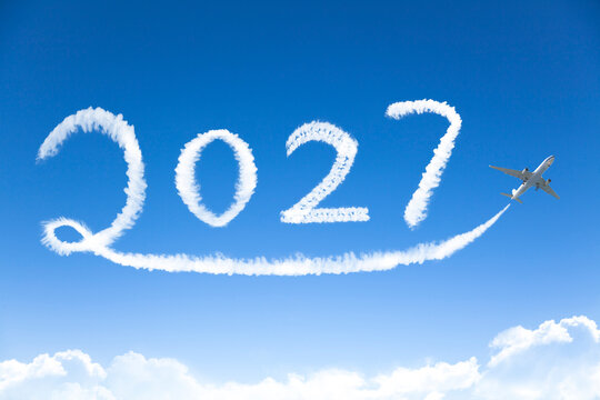 Happy New year 2027 concept. cloud drawing by airplane in sky