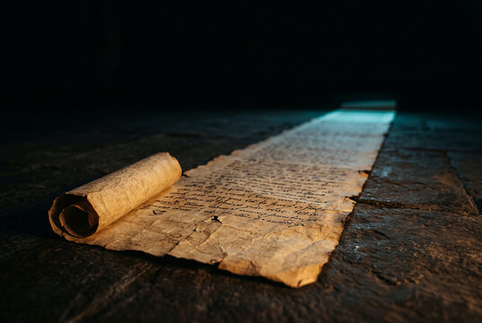 Endless handwritten scroll unrolling into darkness, long read concept