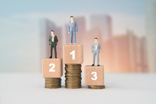 Miniature  businessmen  standing on wooden cube blocks and stack with 1, 2, 3 number and guarantee symbol, blurred cityscape background