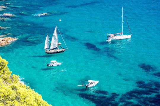 view on bay with turquoise sea and boats on Costa Brava in Spain