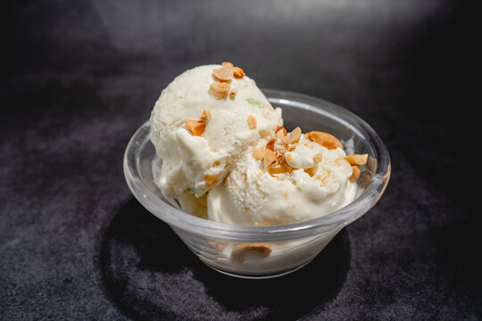 Thai Coconut Ice Cream Topped with Peanuts in a Bowl