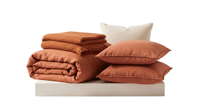 Folded Orange Bedding Set with Pillow and Duvet on White Background