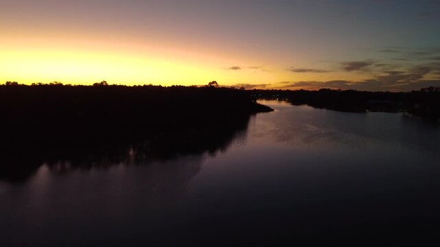 River Murray sunrise, serene morning light over Australian water landscape