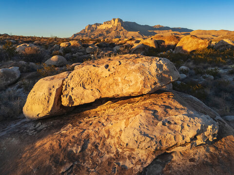 Boulders in desert landscape with El Capit&aacute;n mountain in guadalupe