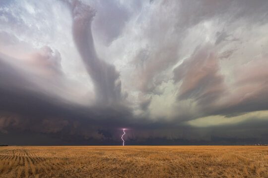Supercell thunderstorm with lightning and tornado over kansas plains