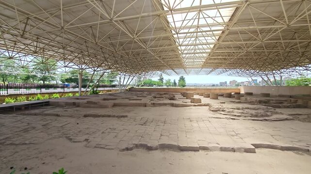 Ruins of Masjed e Madreseh in Tus reveal archaeological remains under protective shelter.