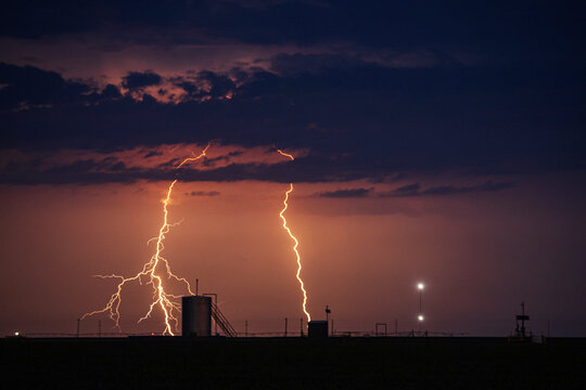 Lightning striking over Farm Fields at night in perryton texas
