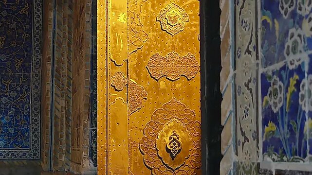 Shah Abbas Mosque wall and doorway ornament display tilework and golden Islamic detail.