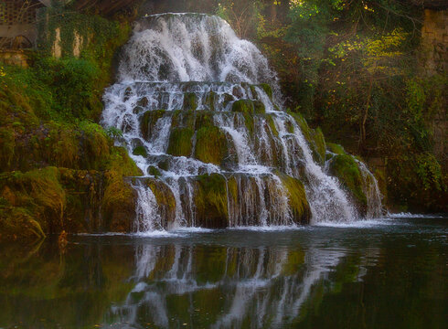 Scenic cascading waterfall with water reflection in calm river, Rastoke, Slunj, Croatia