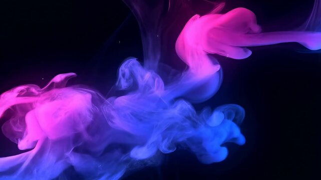 Pink, magenta, blue, and purple ink-like fluid clouds swirl and billow across a black abstract field. Motion graphics, title sequence, and music visualizer.