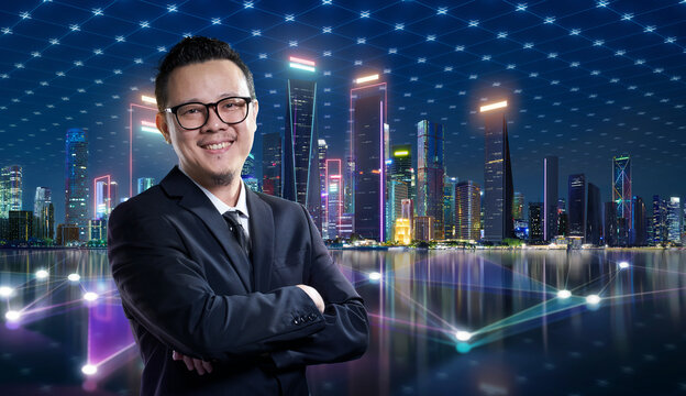 Businessman smiling in front of a futuristic smart city network